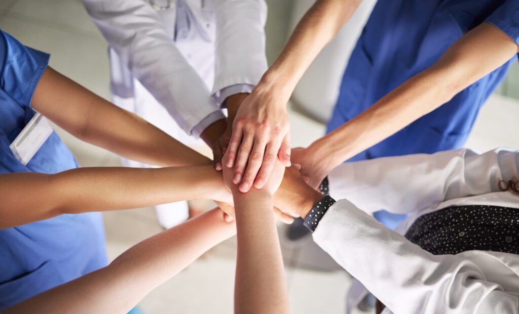 Group of hands in a circle