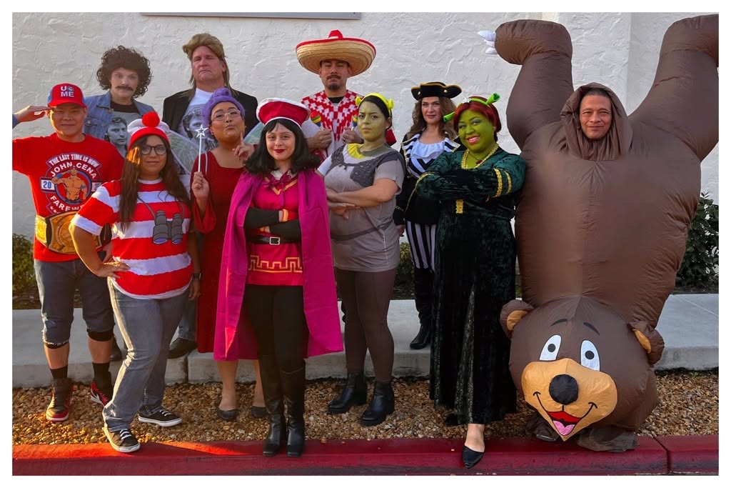 The team dressed in costumes for halloween.